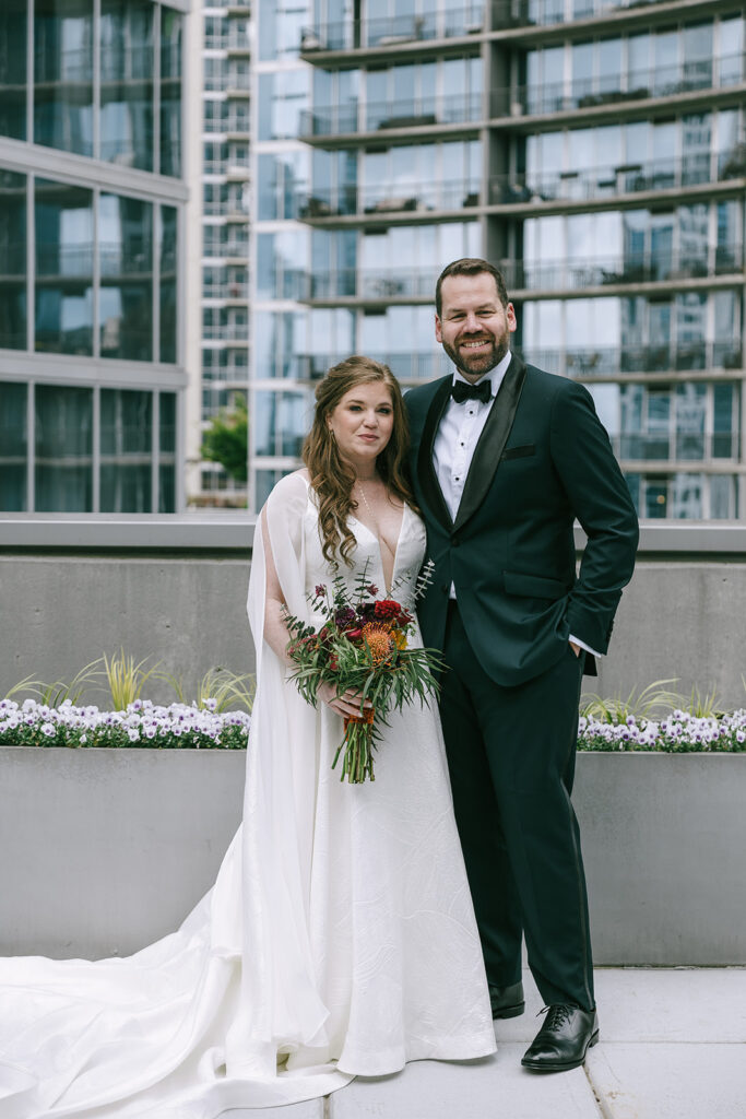 bride and groom looking at the camera