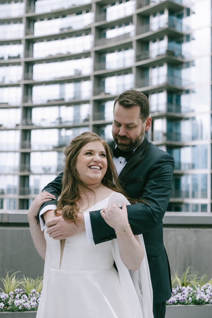 bride and groom hugging 