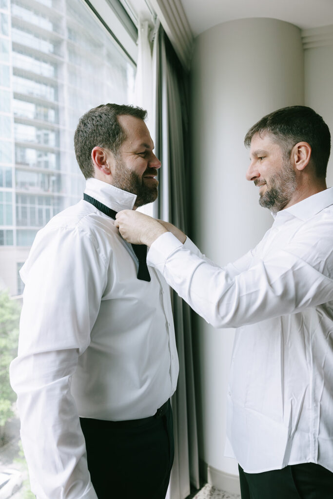 groom getting ready for his intentional wedding day 