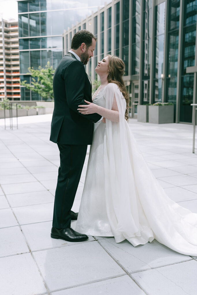 bride and groom looking at each other 