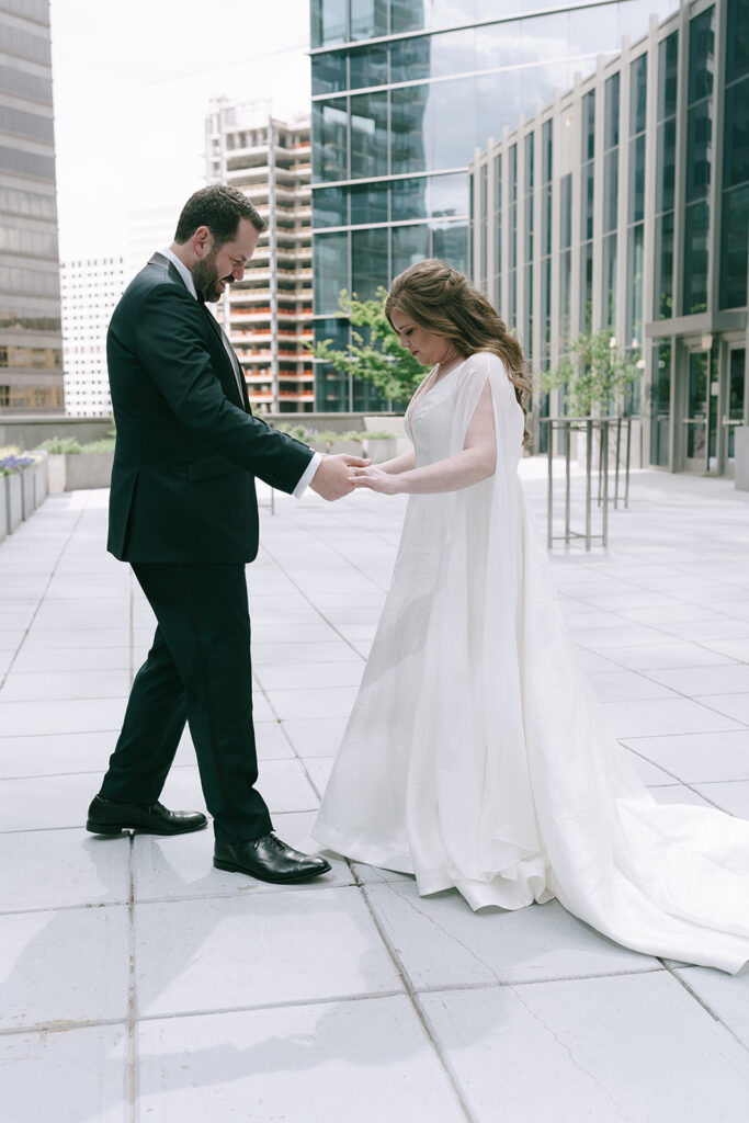 bride and groom holding hands