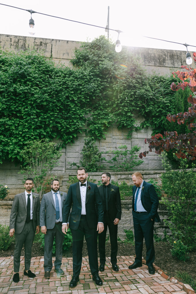 picture of the groom and his friends at the intentional wedding day