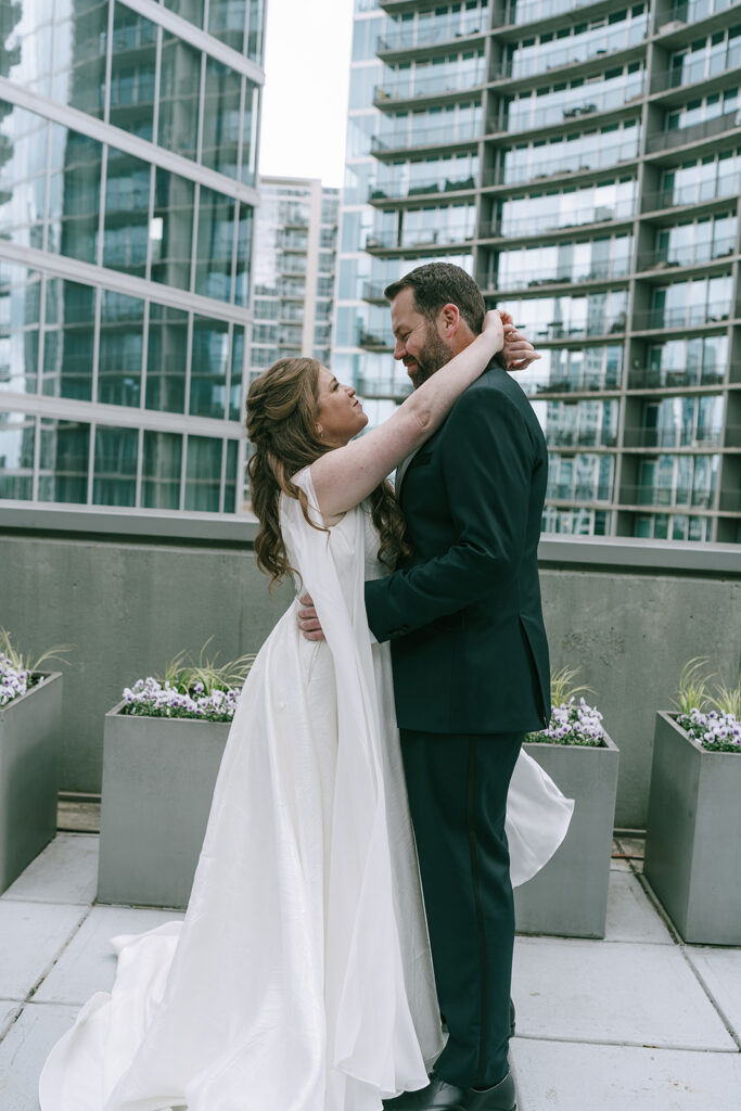 bride and groom looking at each other 