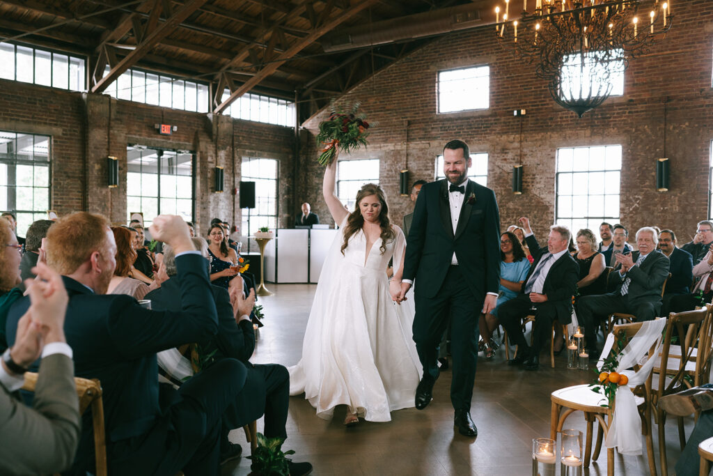 bride and groom heading to their wedding reception