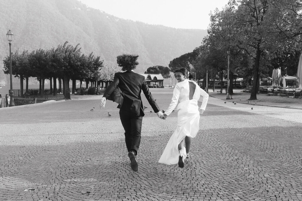 couple running during their session in lake como