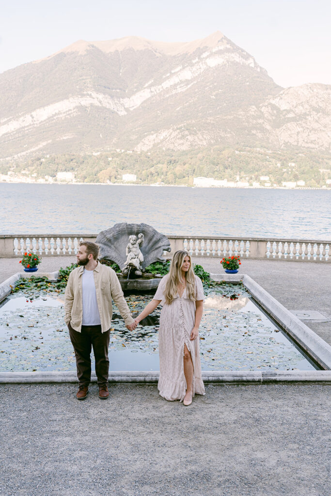 couple holding hands looking at each other 