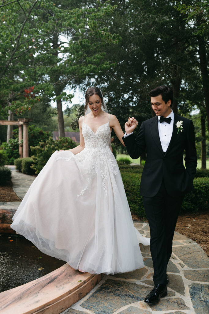 bride and groom holding hands