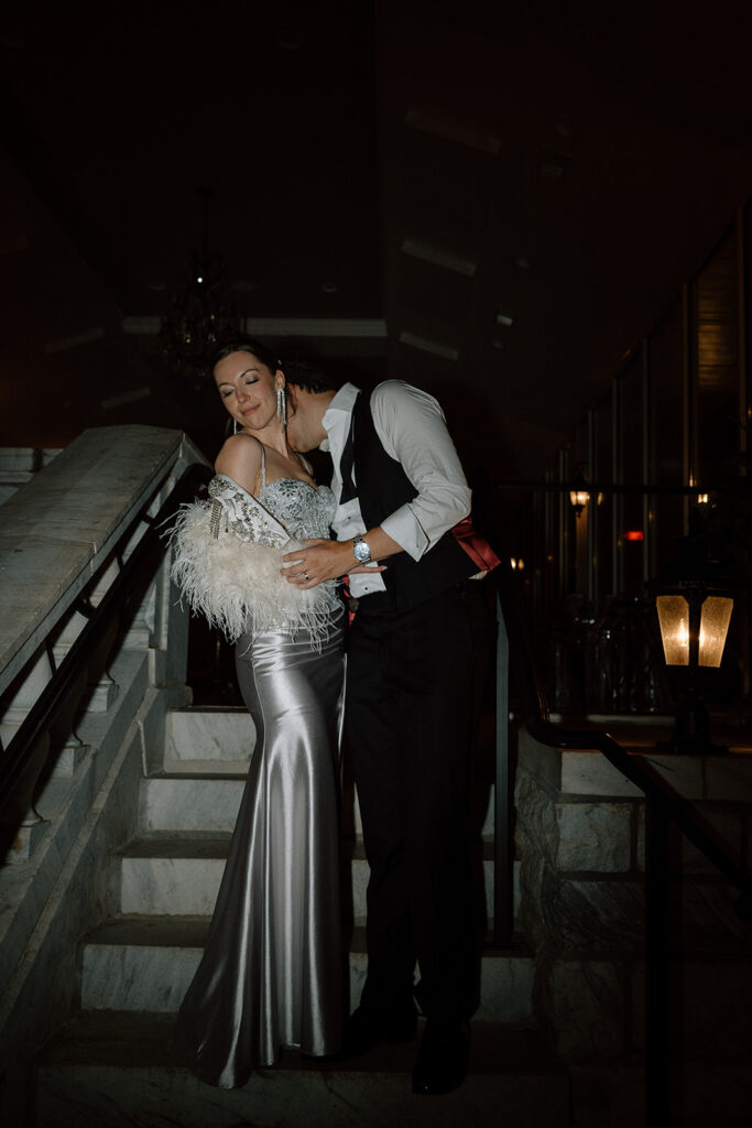 groom kissing the bride on the neck