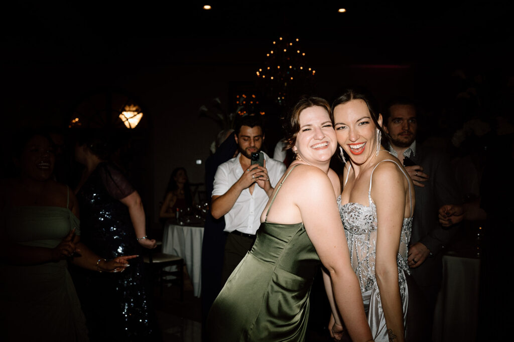 bride and her friends dancing at the wedding reception