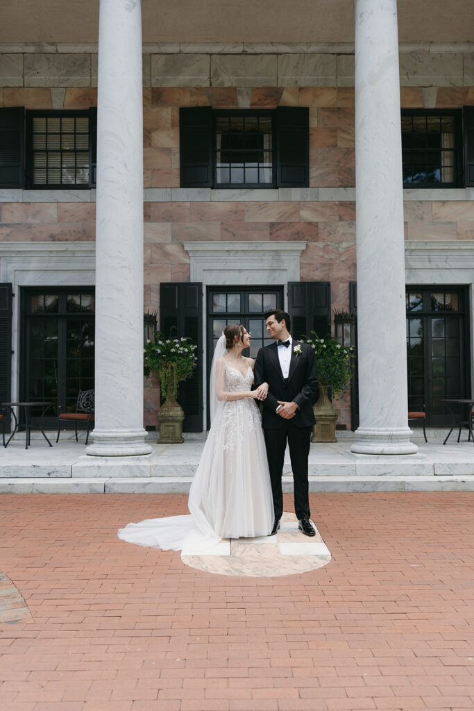 bride and groom looking at each other 