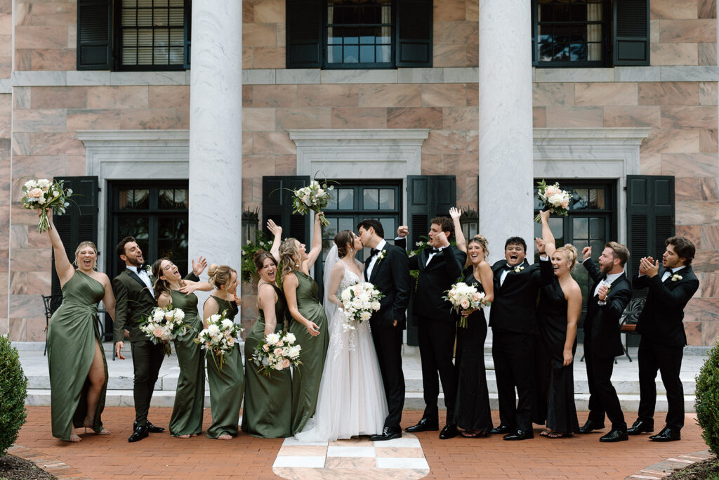 bride and groom kissing at their old money weeding 