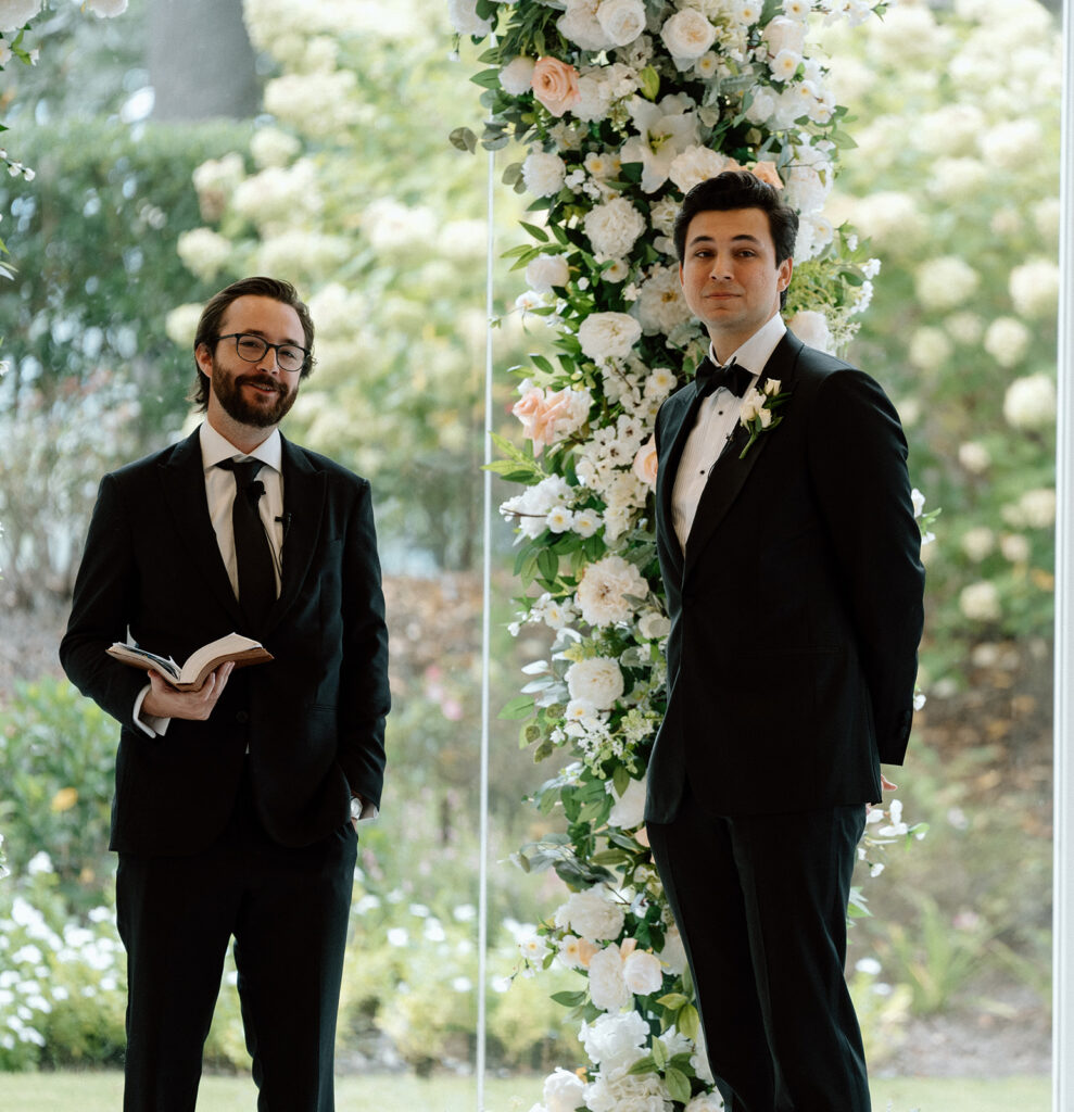 groom watching the bride walk down the aisle 