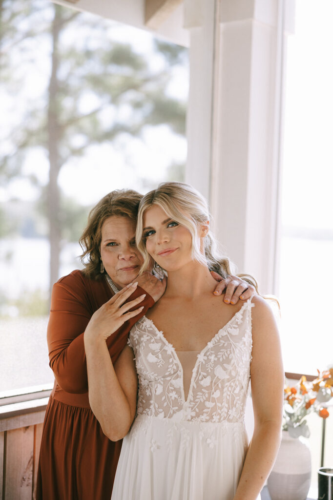 cute picture of the bride and her mom at the lake house wedding 