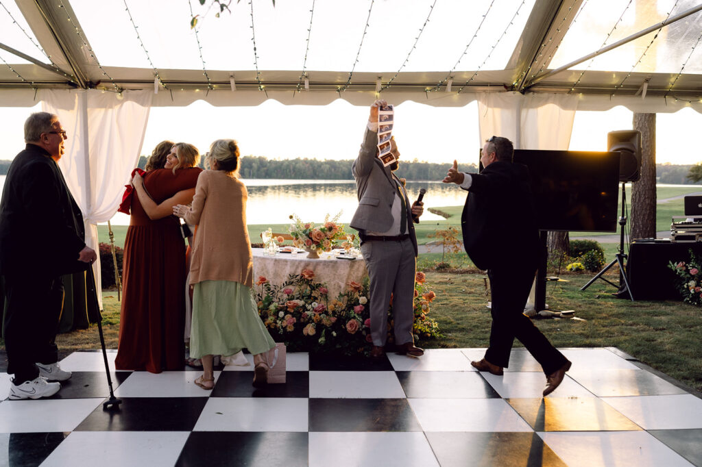 happy couple at their lake house wedding reception