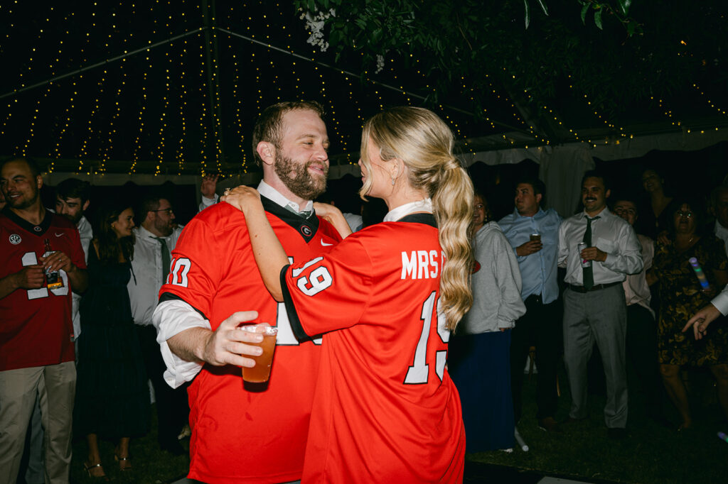 happy newly married couple at their lake house wedding reception