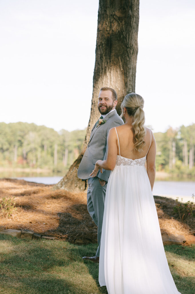 groom seeing the bride on her wedding dress for the first time