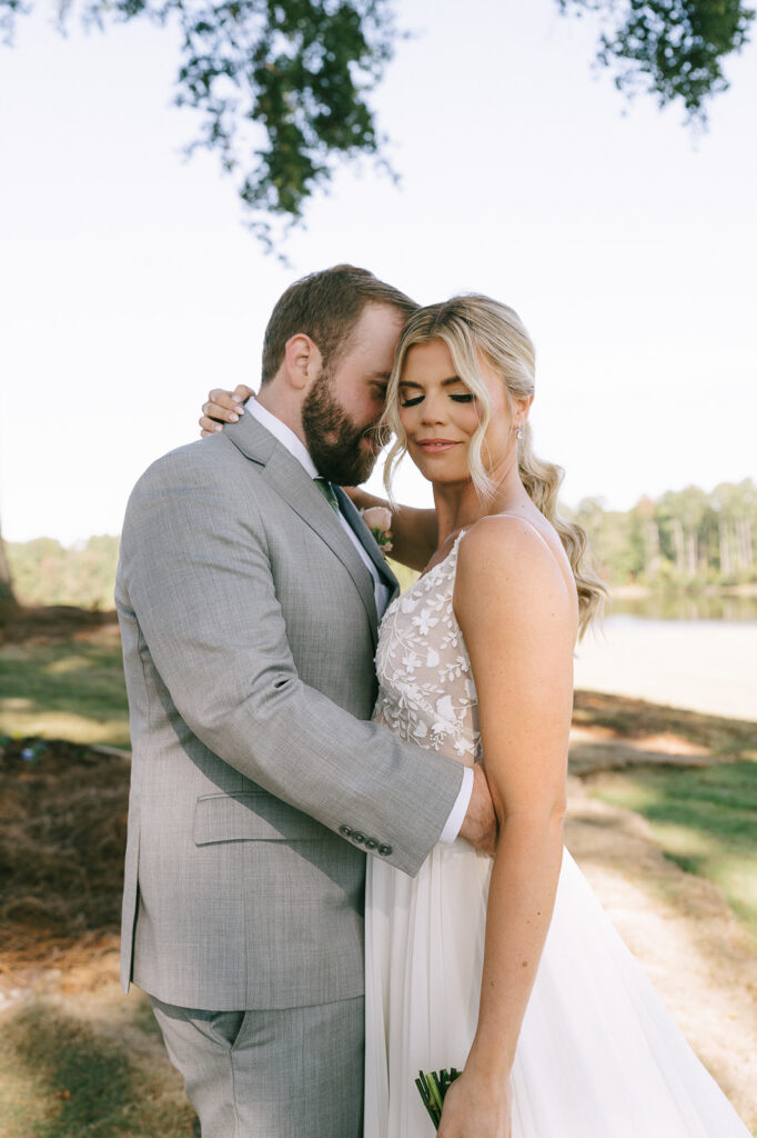 happy bride and groom at their dream lake house wedding 