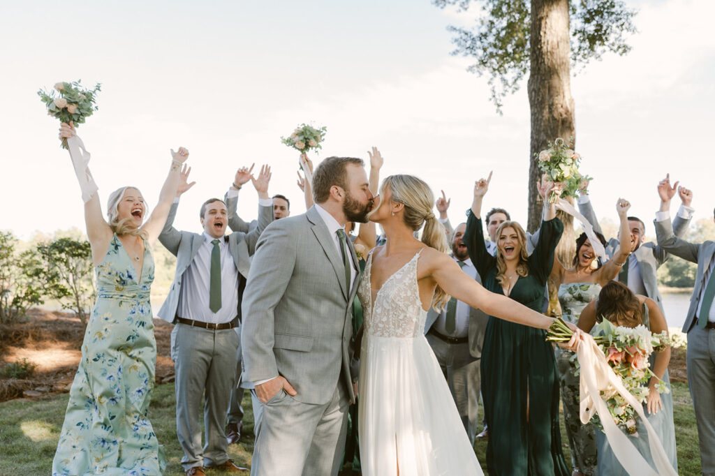 picture of the bride and groom with their bridesmaids and groomsmen 