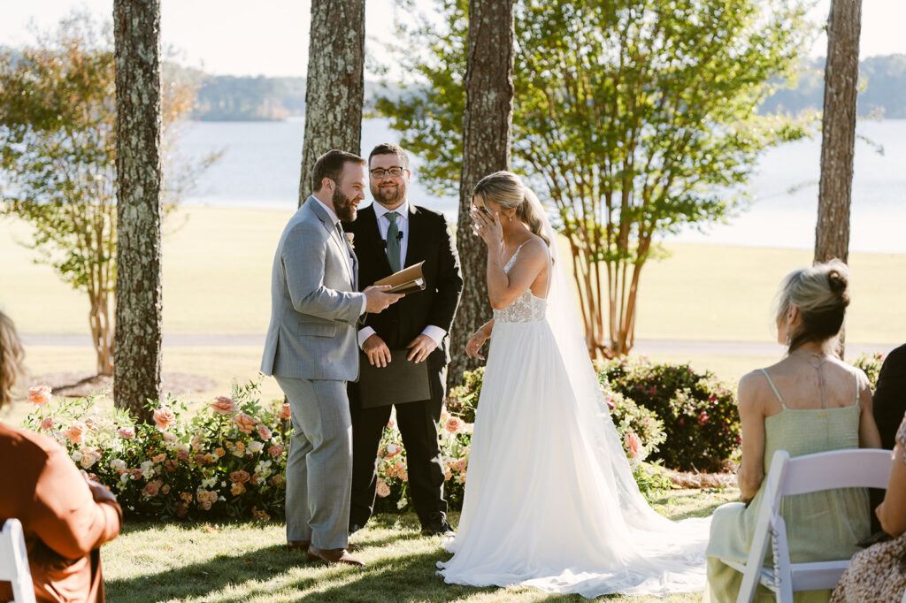 cute couple at their lake house wedding ceremony 