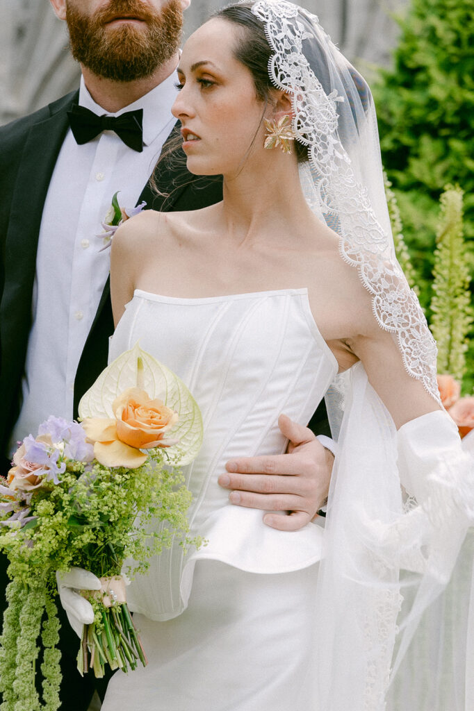 bride and groom hugging 