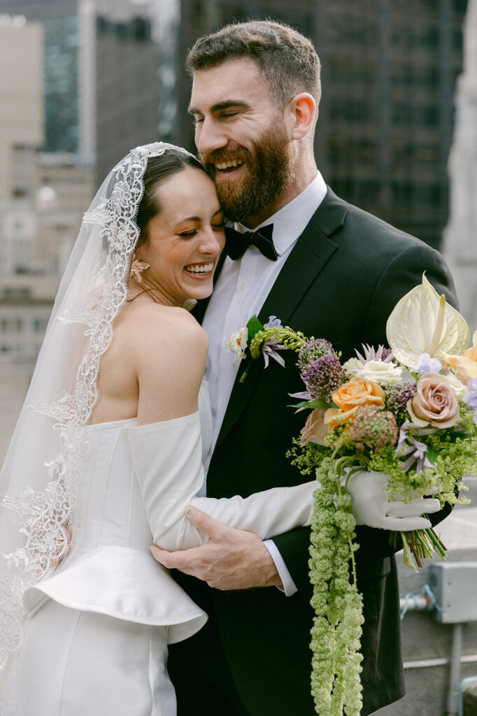 bride and groom laughing