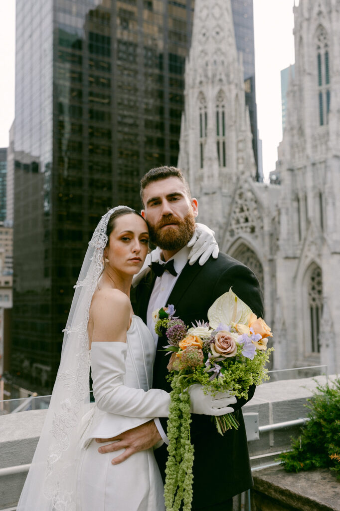 bride and groom looking at the camera