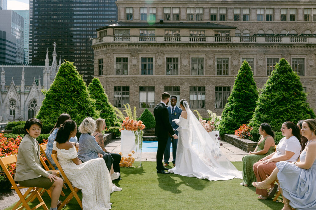 bride and groom holding hands at their wedding ceremony