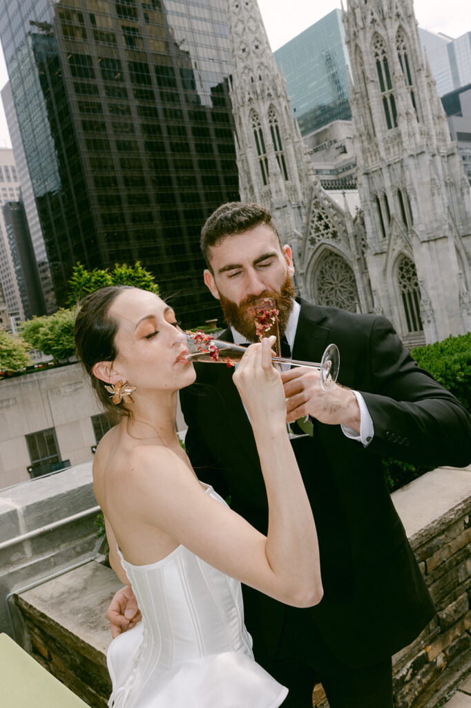 bride and groom drinking champagne 