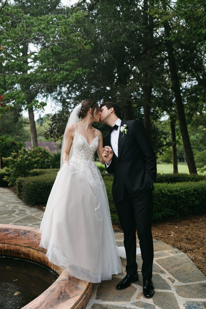 picture of the bride and groom kissing 