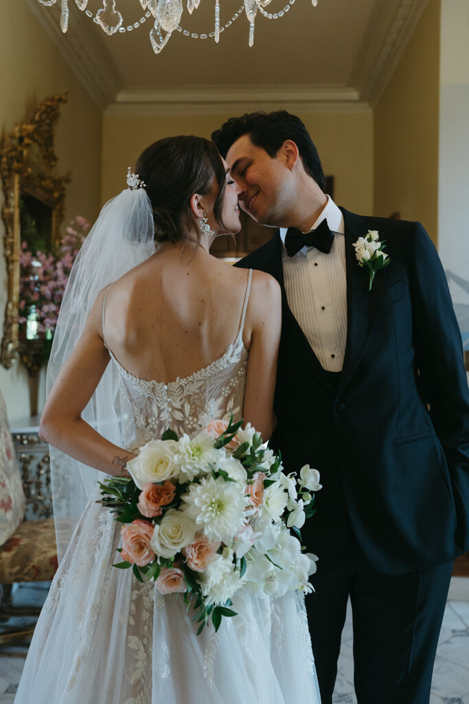 bride and groom looking at each other 