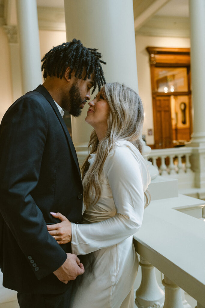 newly engaged couple looking at each other 