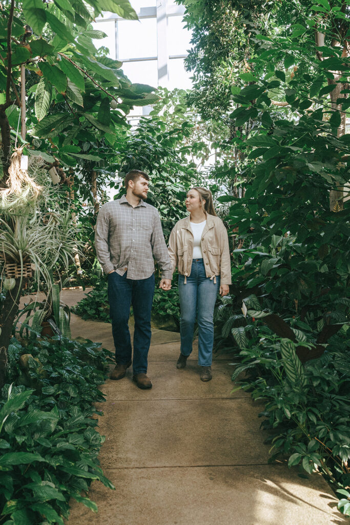 cute couple walking around a botanical garden