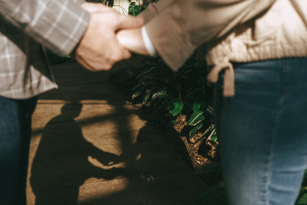 cute couple holding hands during their engagement photoshoot