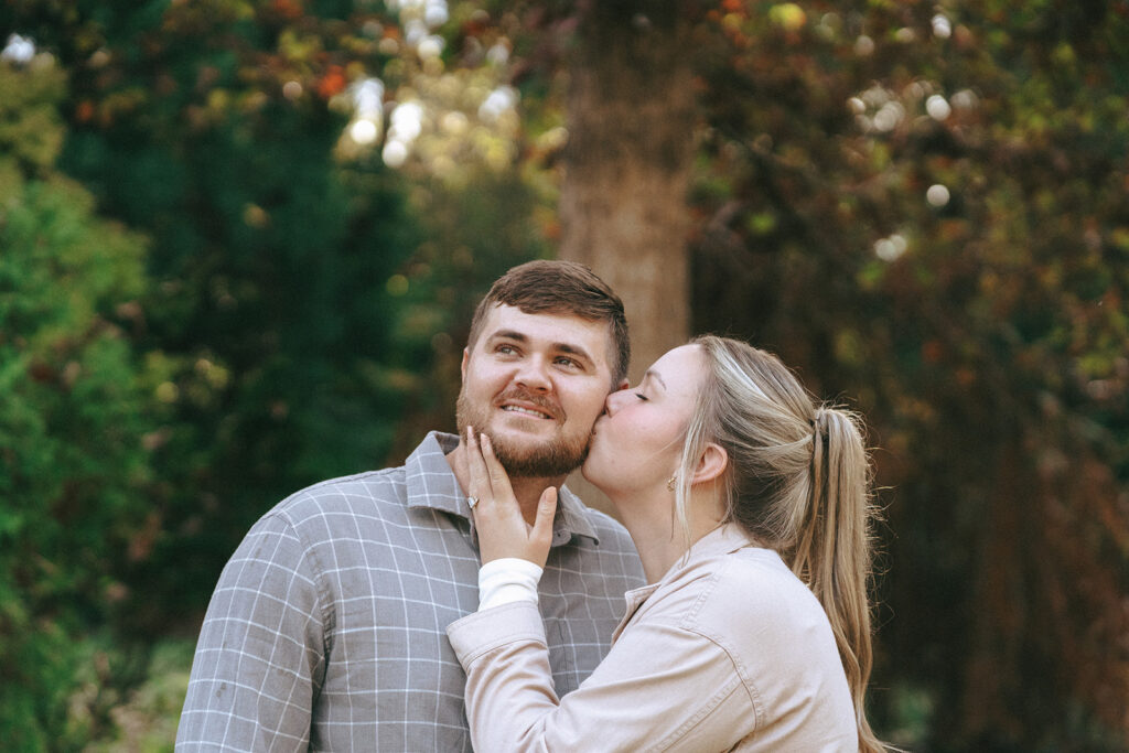 cute picture of the fiance kissing her fiance on the cheek