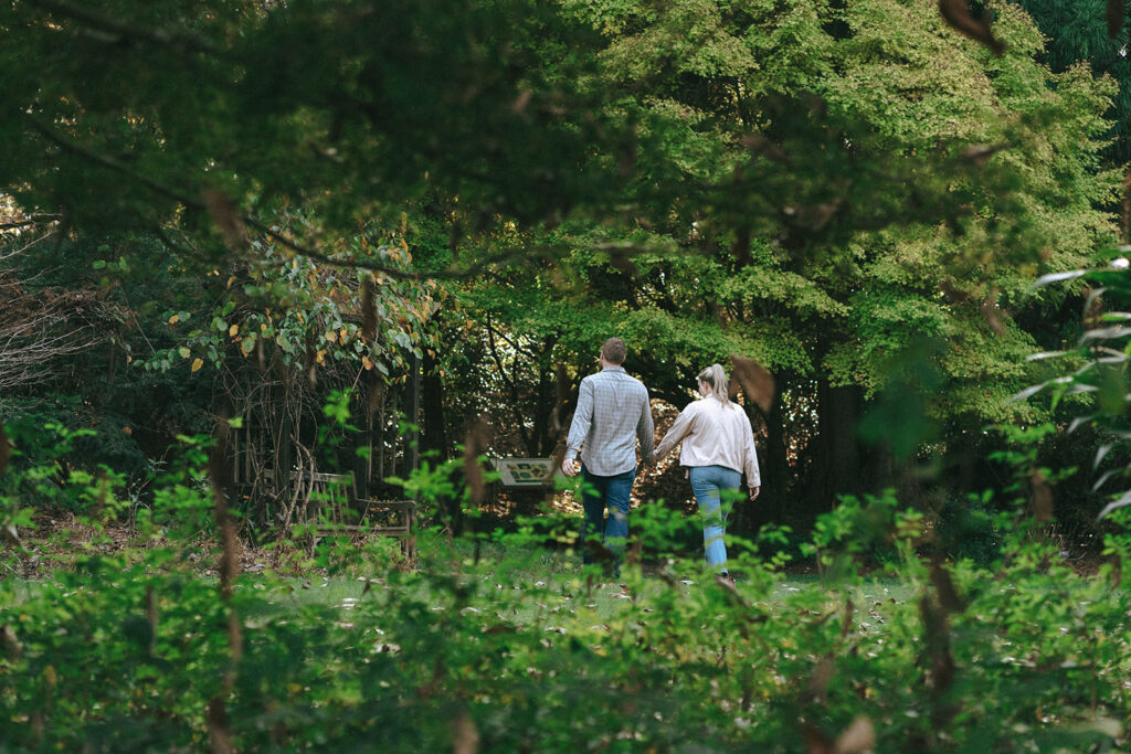 couple walking around a botanical garden 