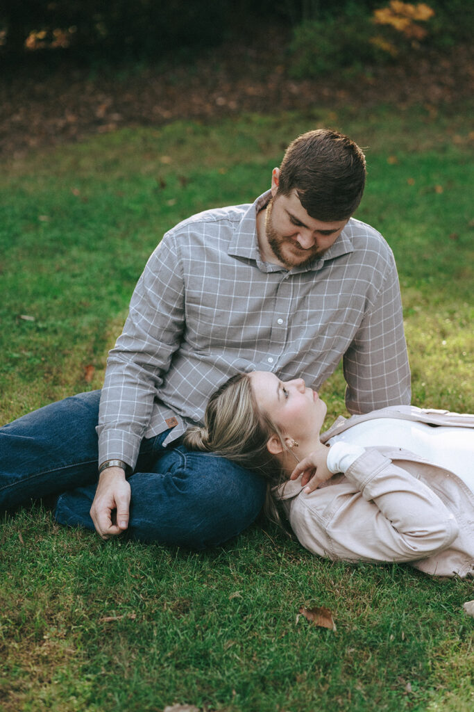 cute couple looking at each other during their fun engagement session