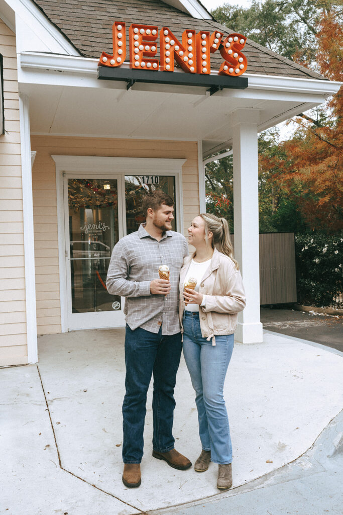 newly engaged couple looking at each other 