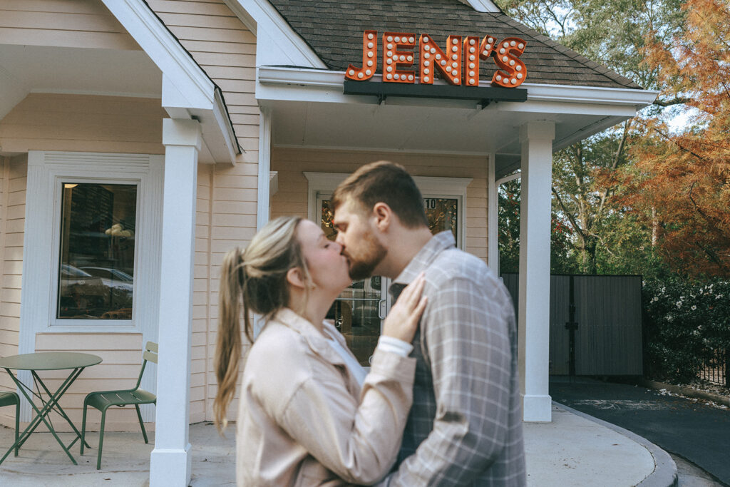 cute couple kissing at their fun engagement session