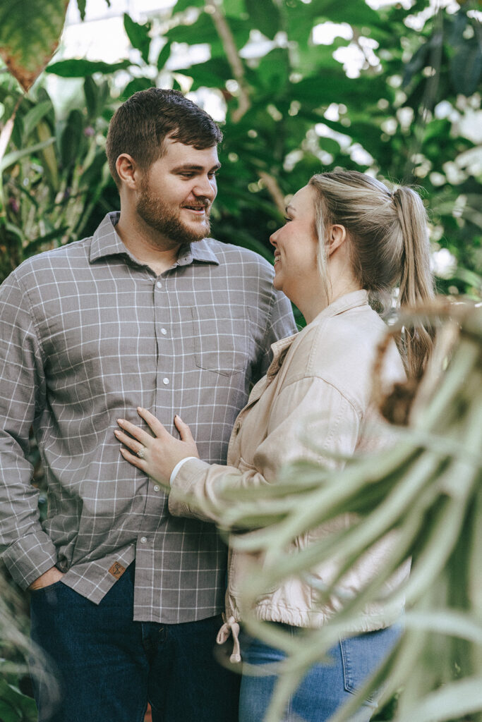 couple looking and laughing with each other during their photoshoot