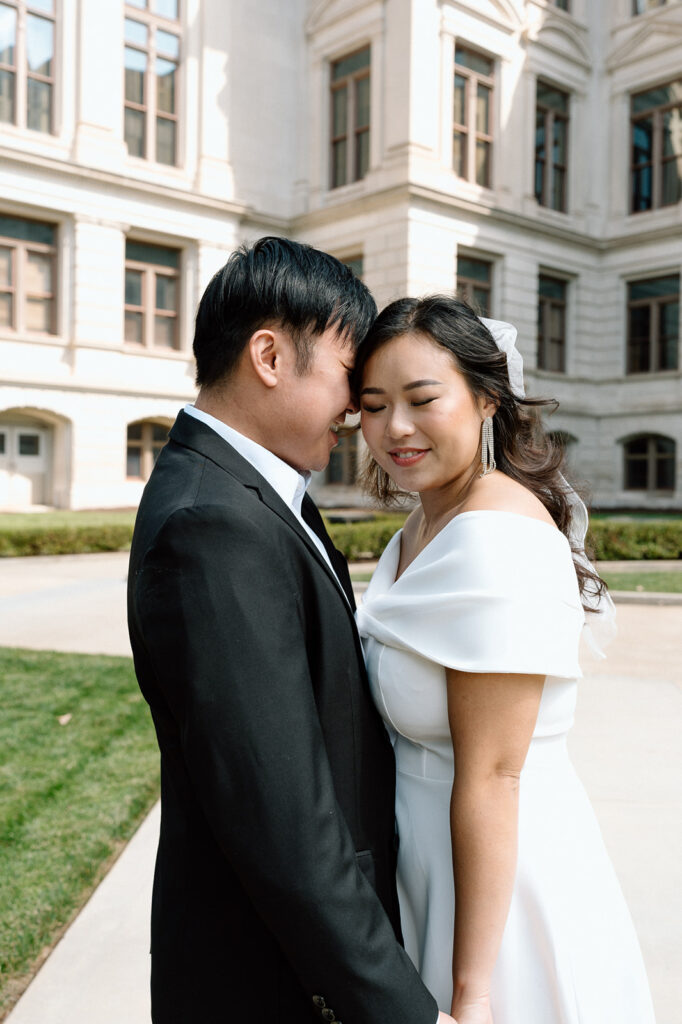 fiance kissing his fiance on the cheek