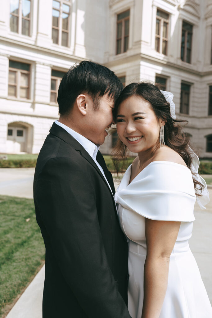 fiance kissing his fiance on the cheek