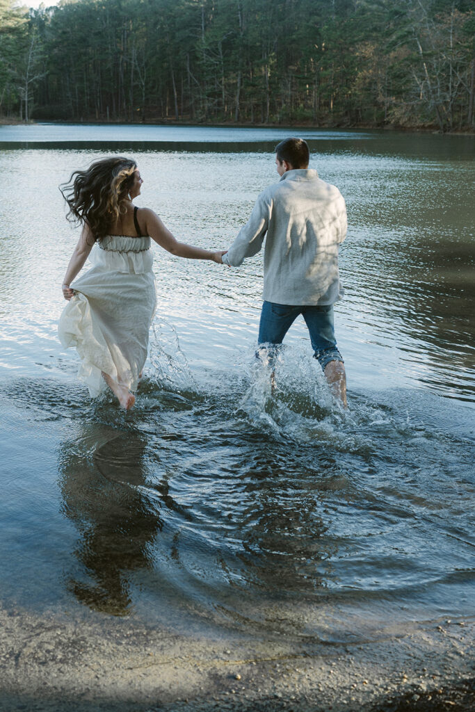 couple running around their engagement location