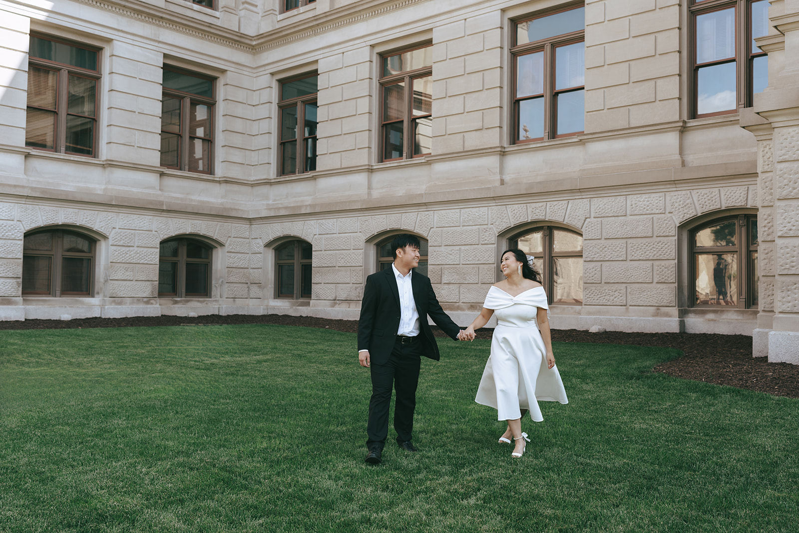 couple walking around their engagement location