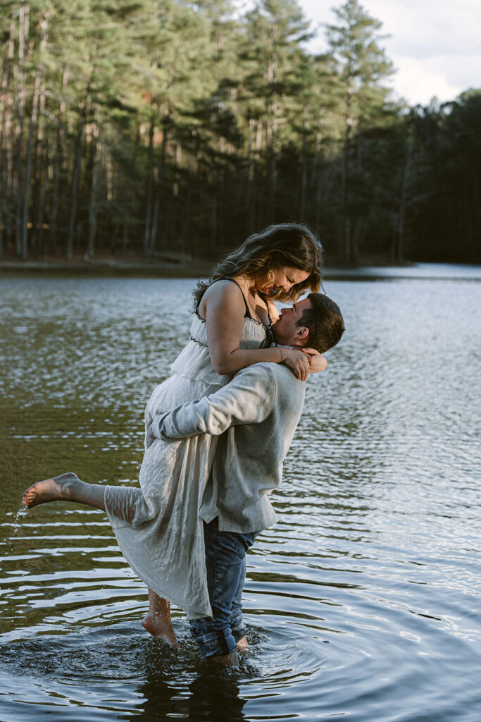 couple smiling at each other during their photoshoot