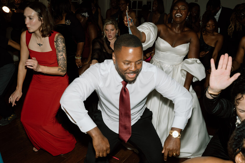 groom dancing at the fall garden wedding reception