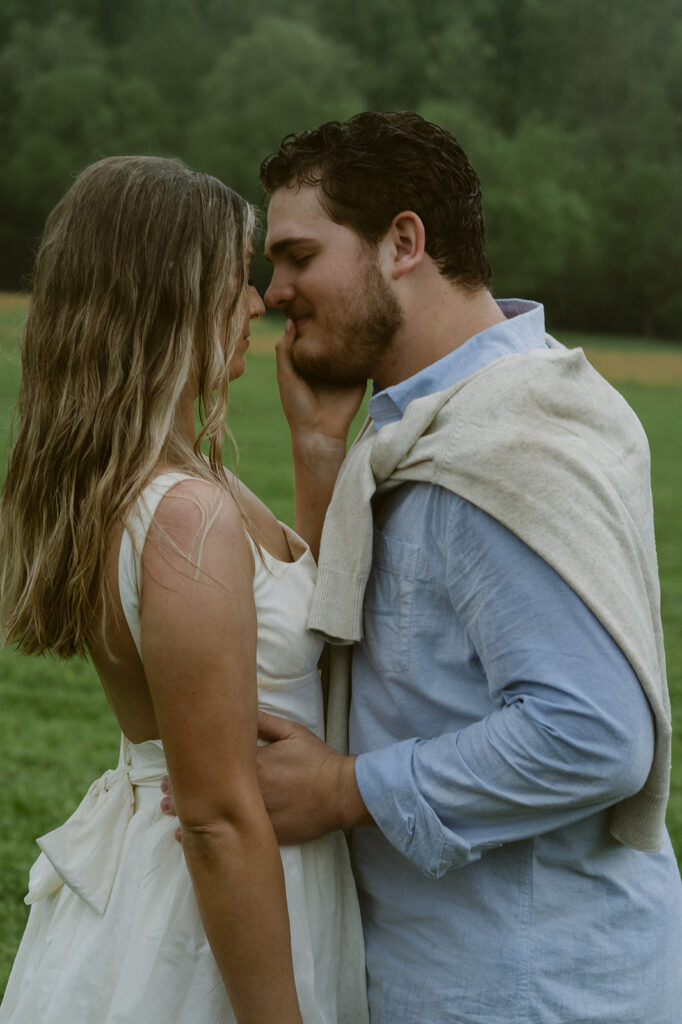 cute couple smiling at each other during their photoshoot