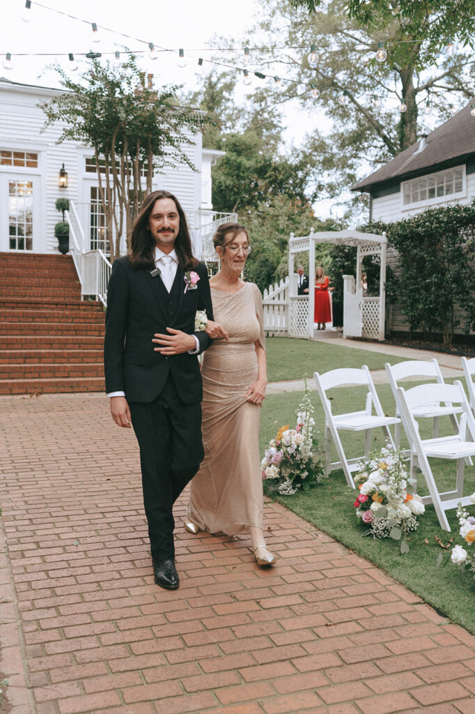 stunning picture of the groom walking down the aisle 