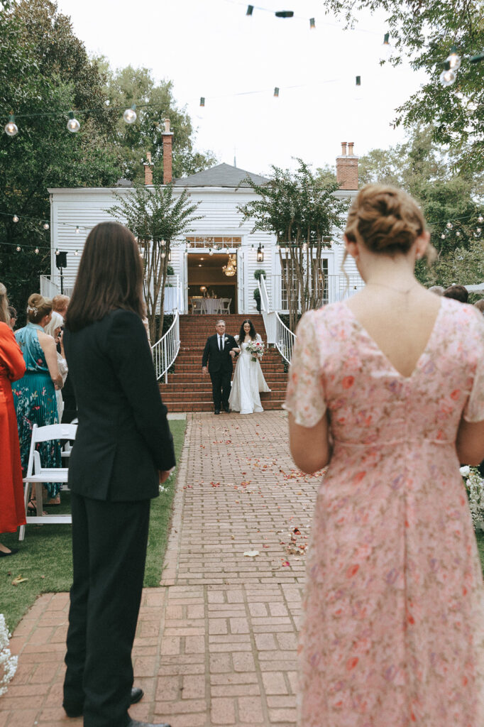 stunning picture of the bride walking down the aisle 