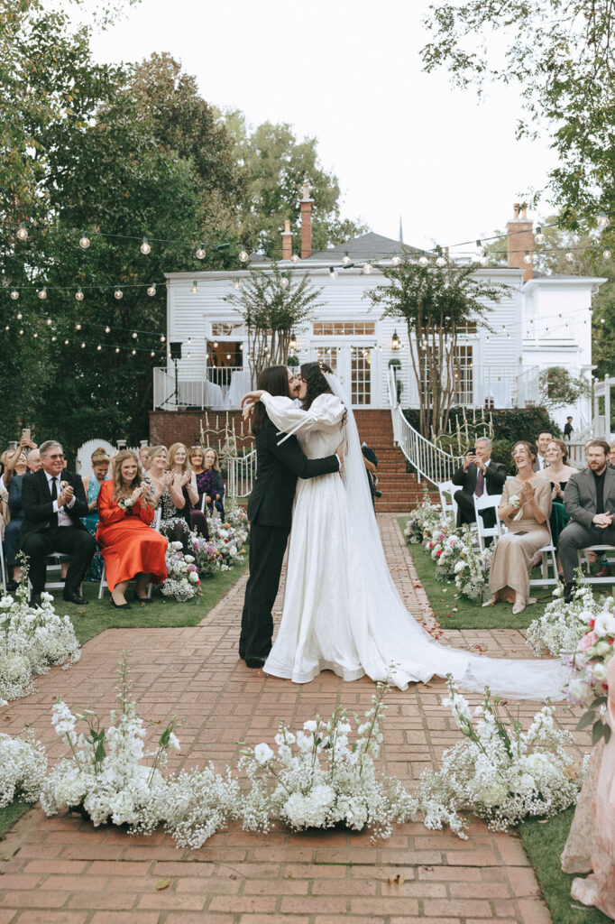 bride and groom kissing during their engagement session