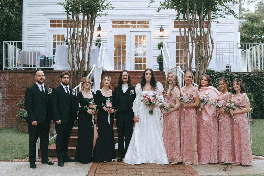 picture of the bride and groom with their bridesmaids and groomsmen 